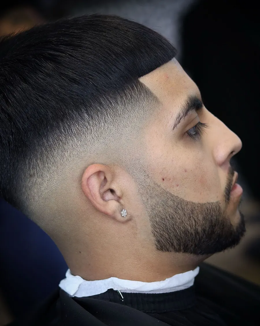 Drop fade blended into a full beard