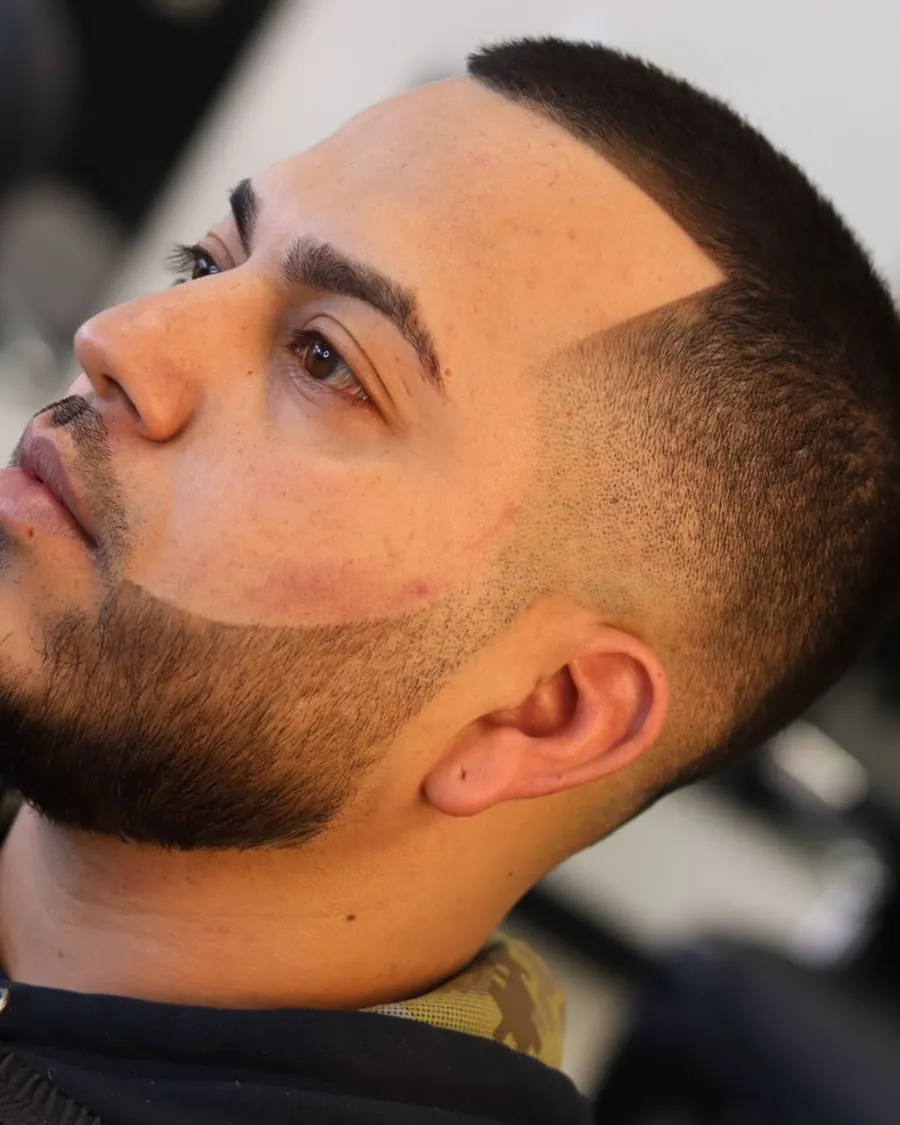 Low fade with a full beard line-up